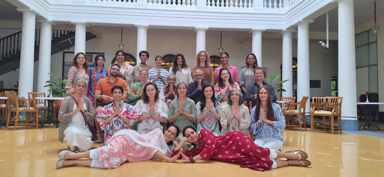 Large retreat group in beautiful courtyard with columns