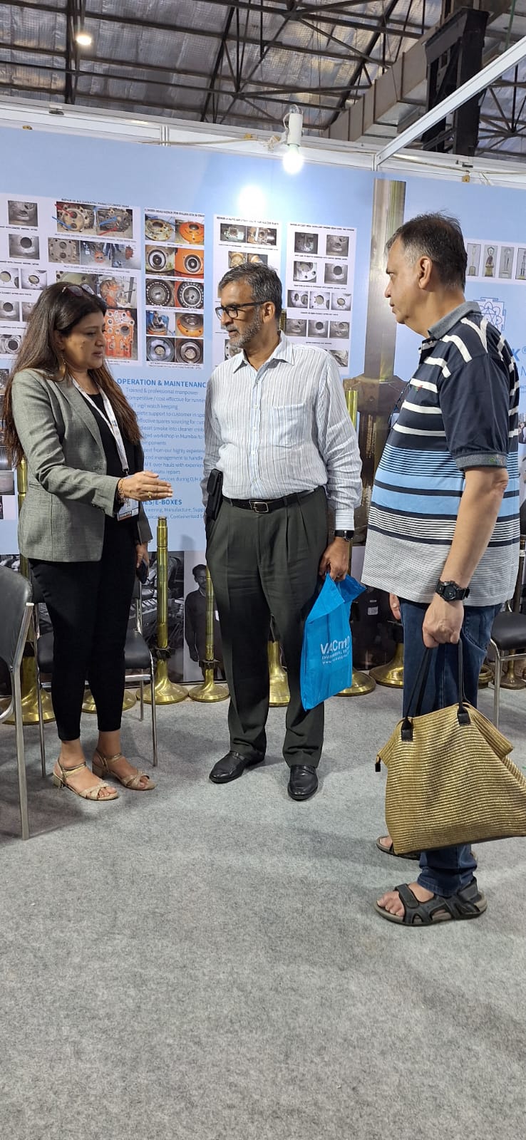 Deepshikha at professional conference speaking with colleagues