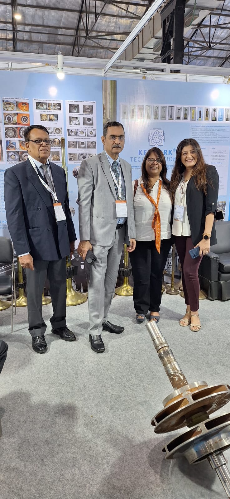 Deepshikha with industry professionals at exhibition booth
