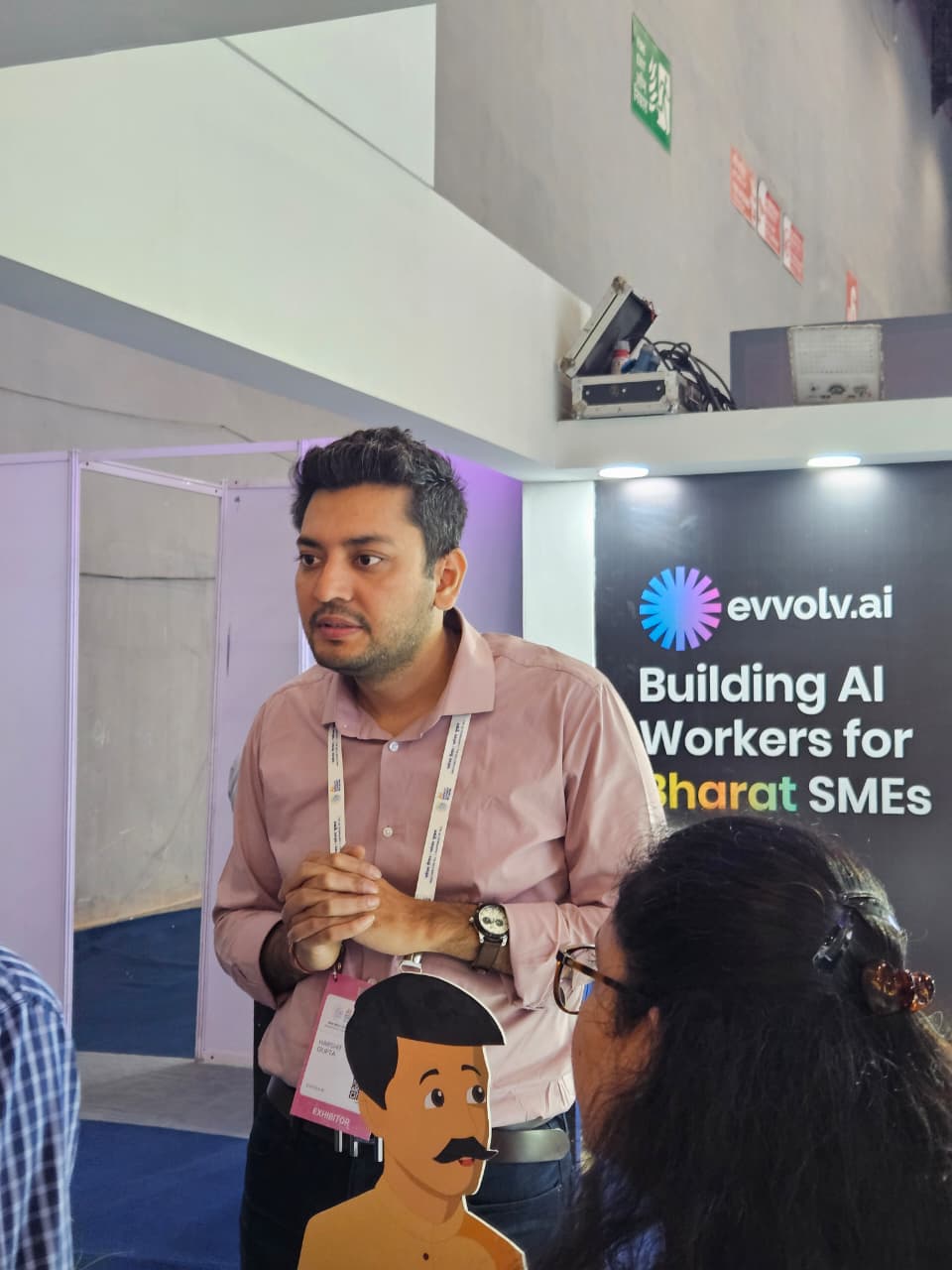 Harshit engaging with visitors at booth