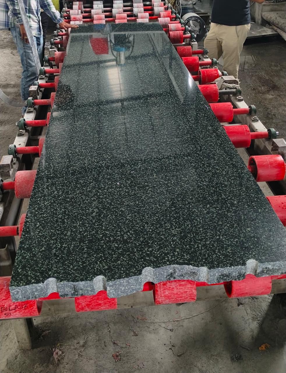 Green granite slab with protective pads
