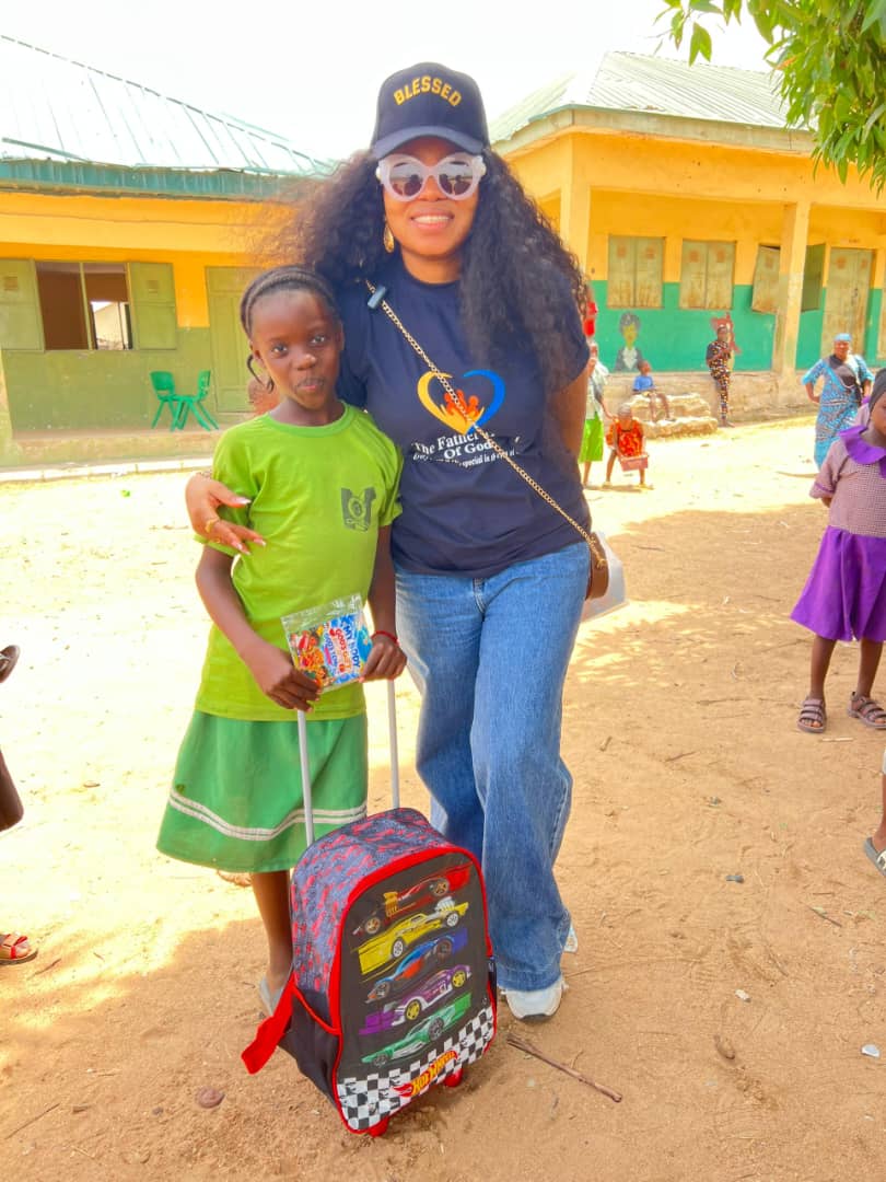 Woman with child receiving backpack