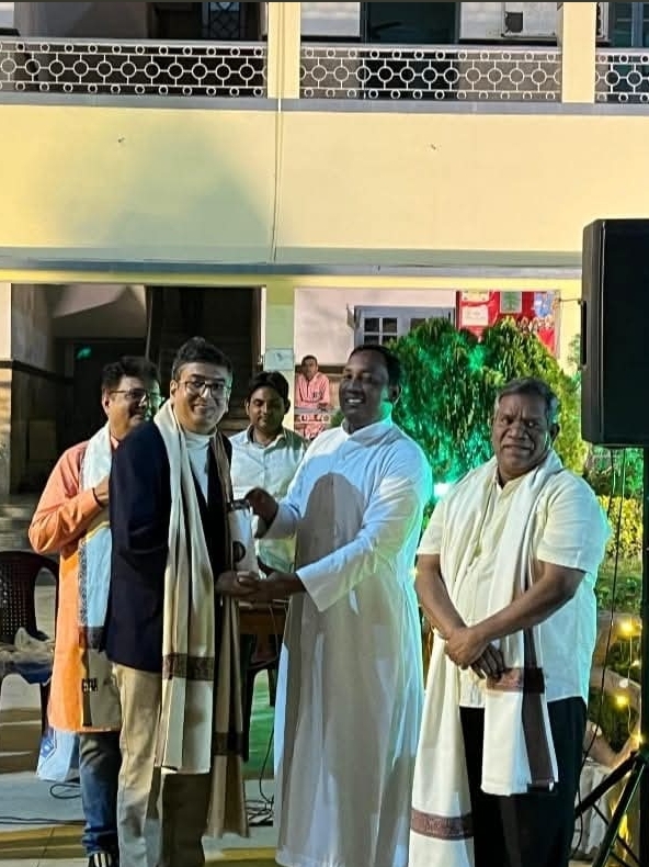 Dr. Bodhisatta Ghosh with colleagues - Professional recognition event