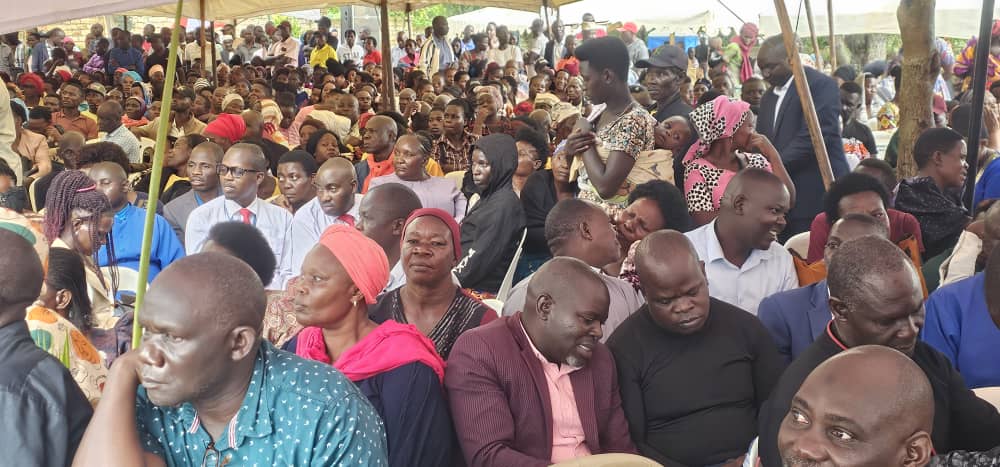 Family and community at burial service