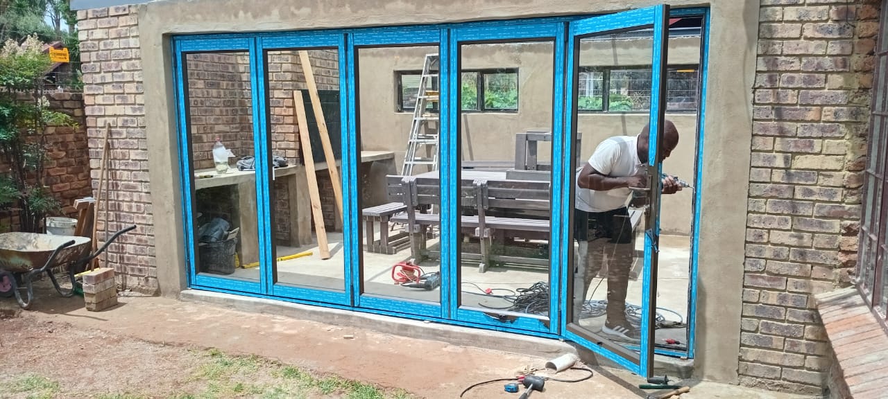 Folding door installation in progress