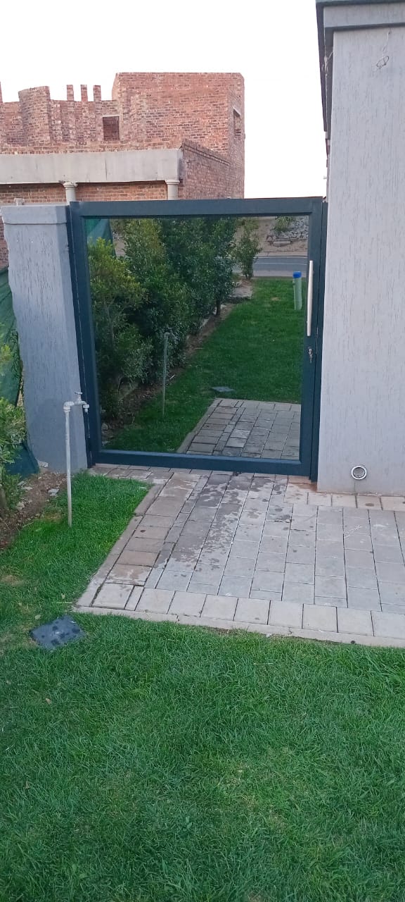 Glass gate in garden