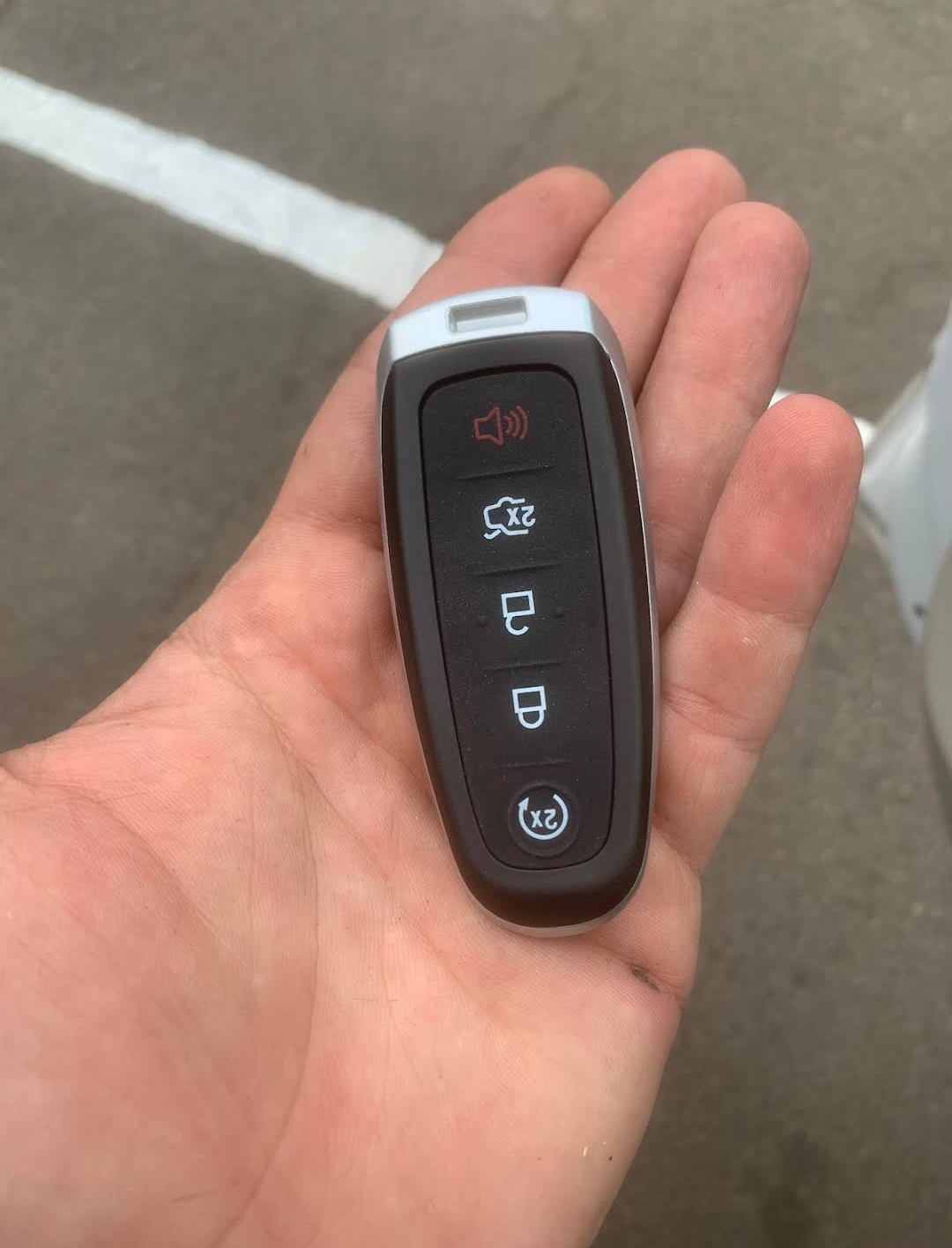 Ford 5-button smart key fob with remote start in palm