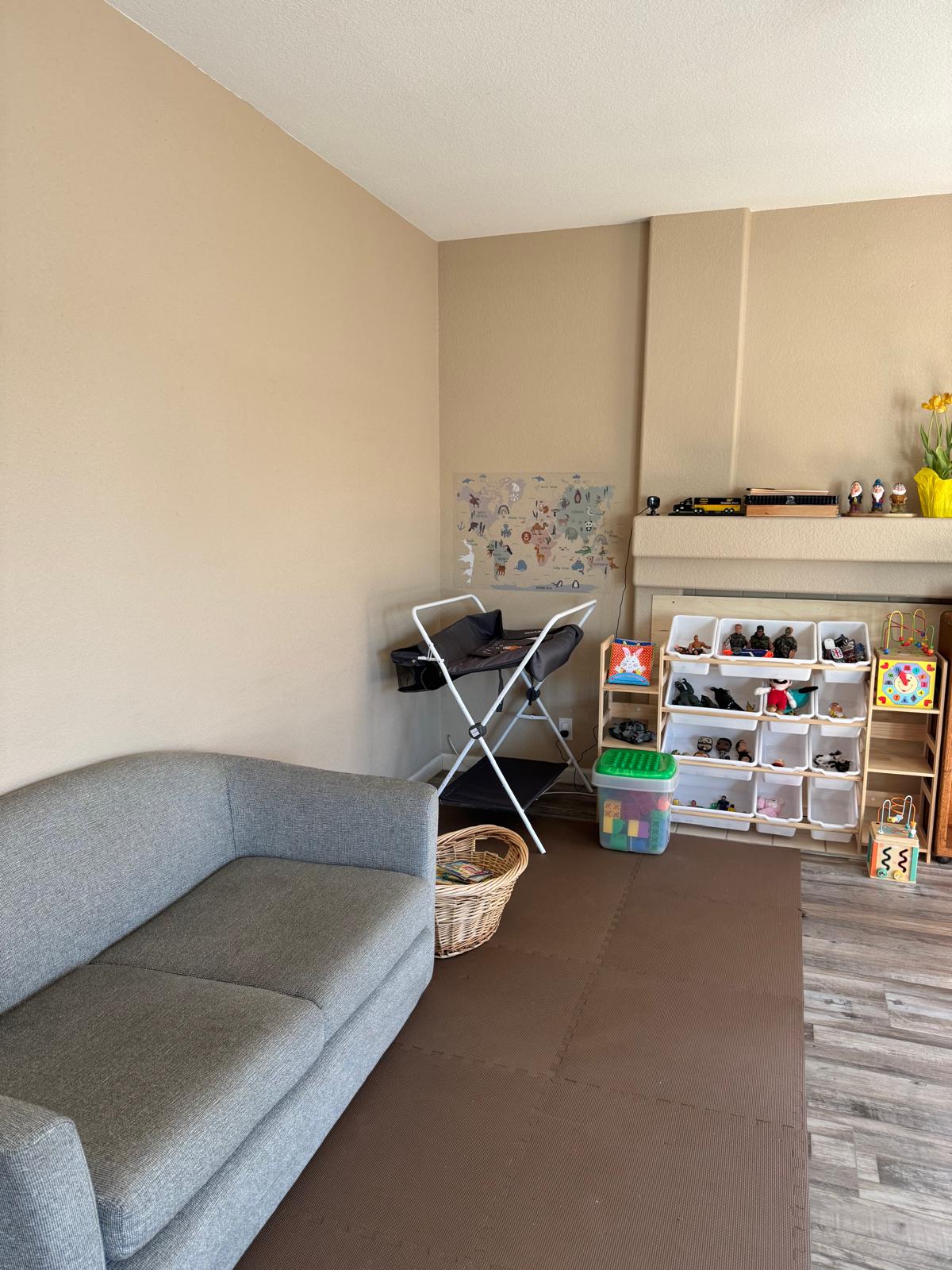 Reading nook with a world map showing animals from different continents