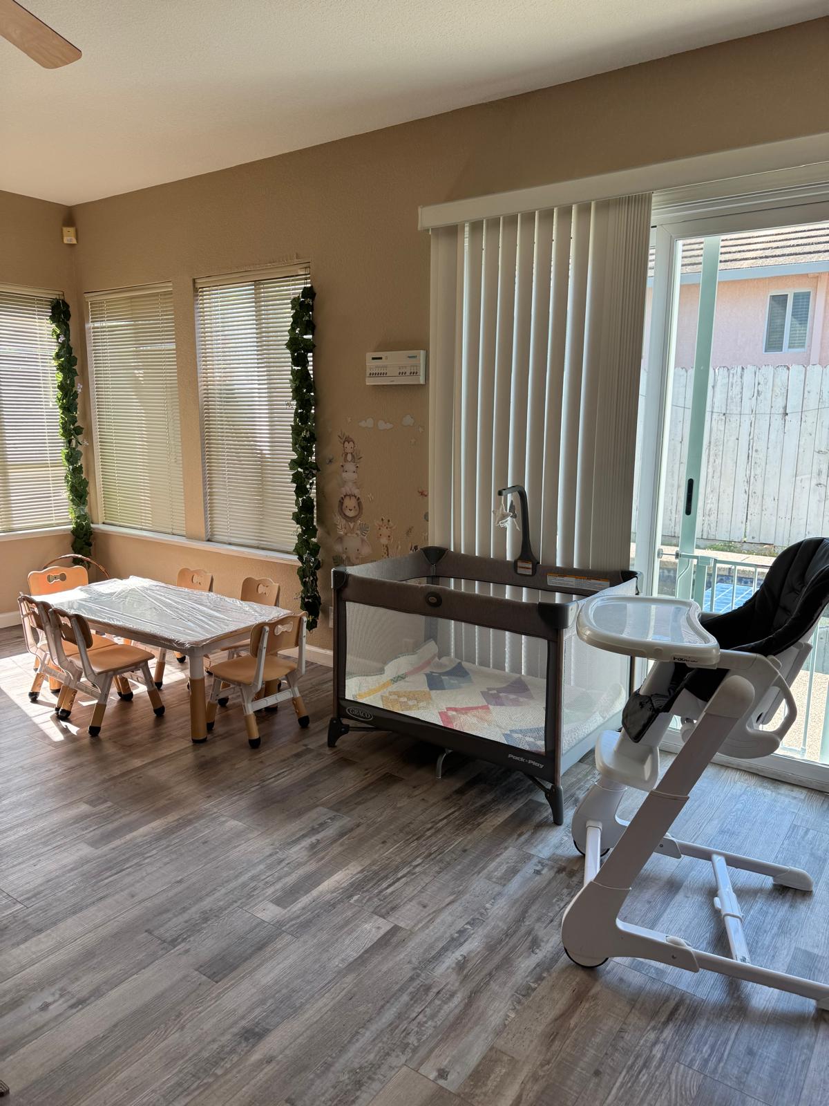 Dining and play area with kids table, high chair and natural decor
