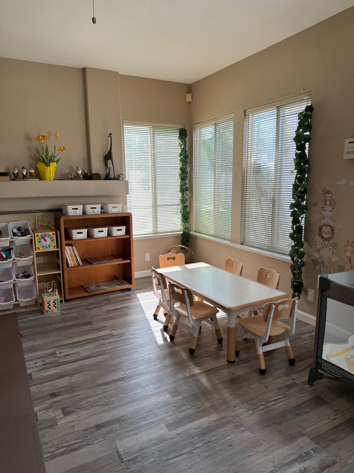 Bright learning room with a children's table, books and natural light