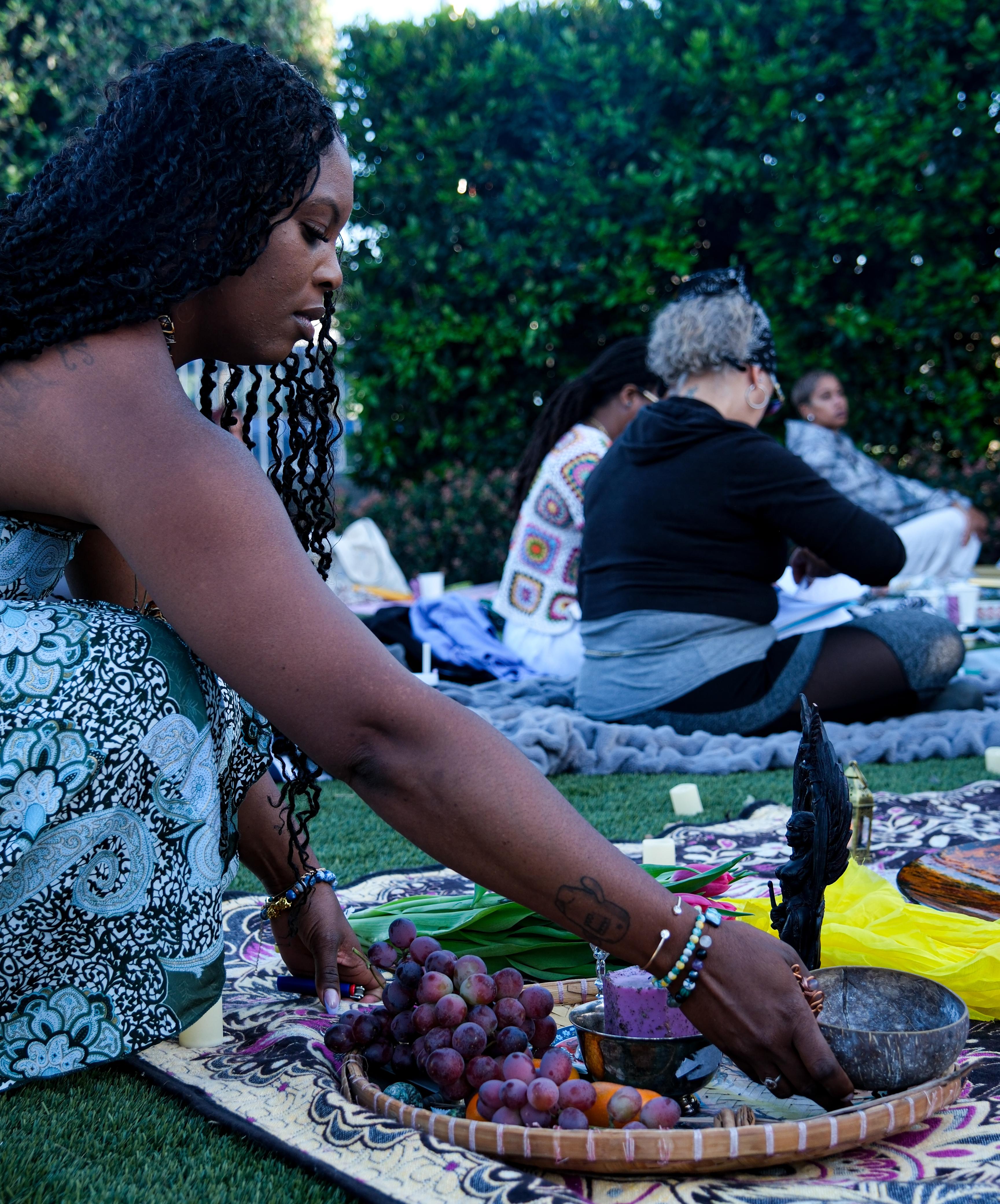 Sacred offerings ceremony with fruits and ritual objects