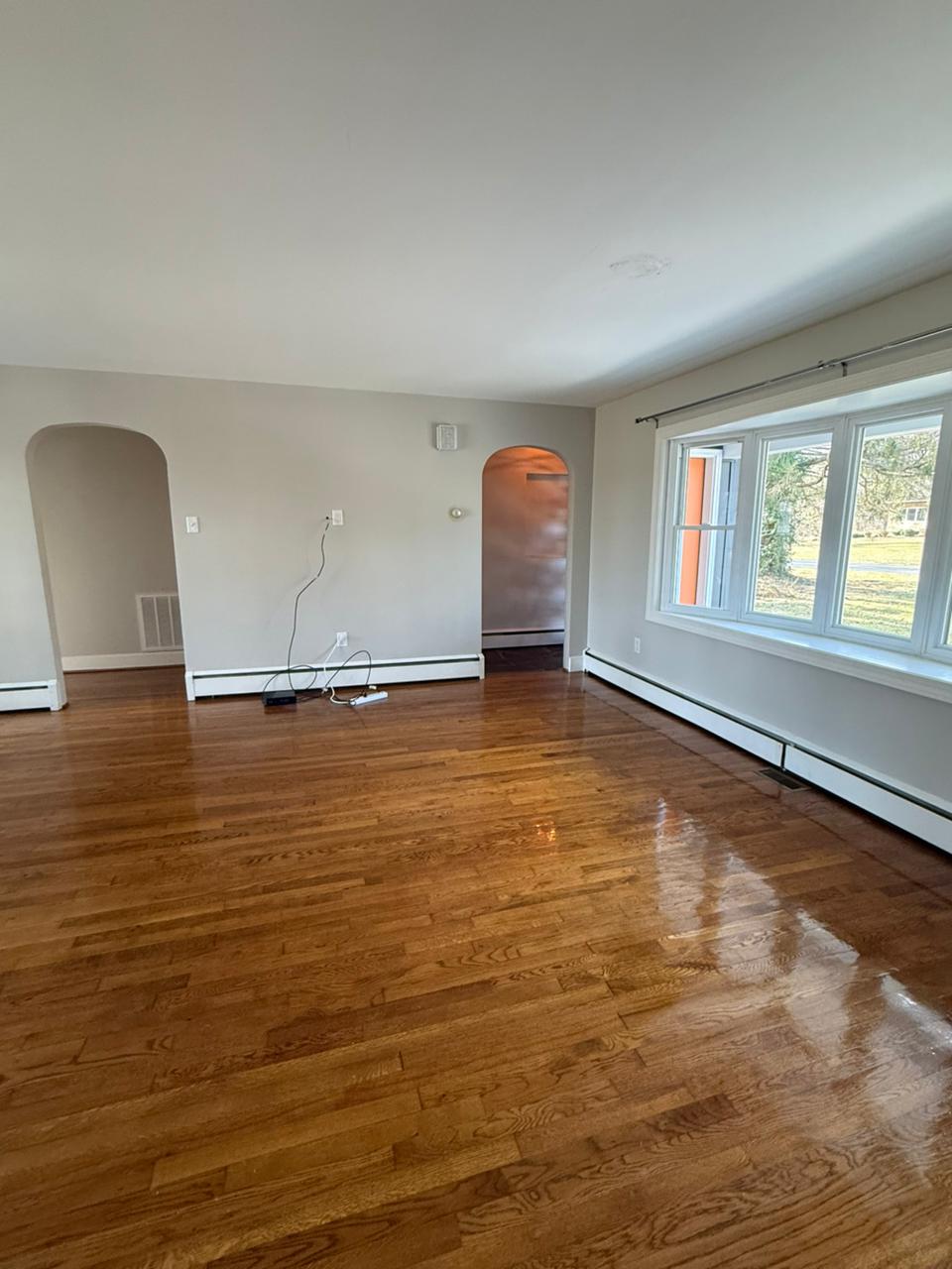 Polished hardwood floors in empty living room
