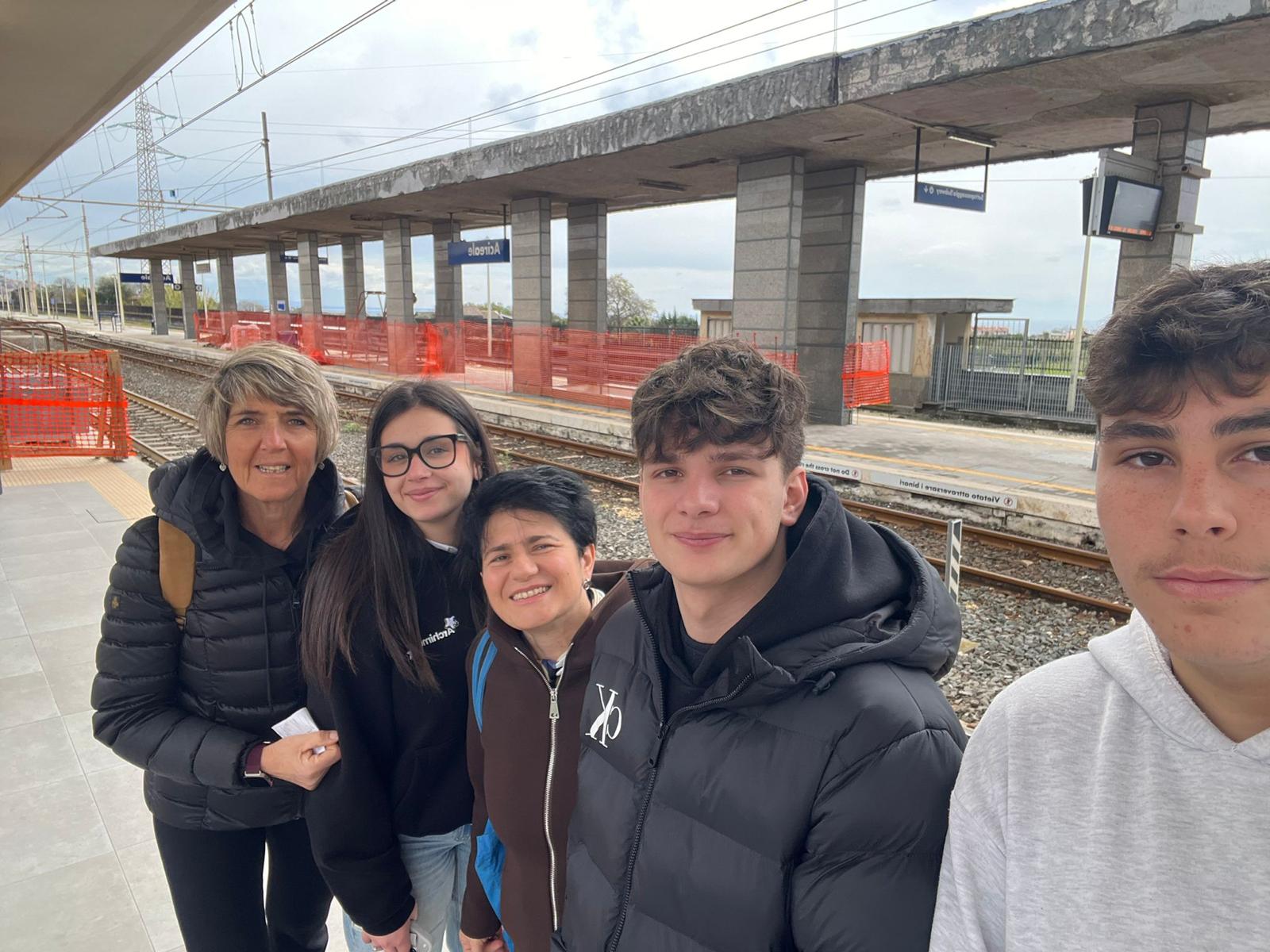 R.A.I.L.S. team members at train station platform during field visit