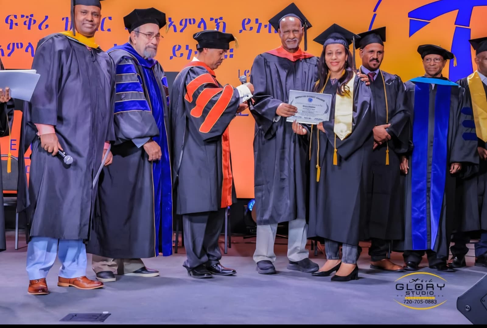 Female Graduate Receiving Certificate — Denver