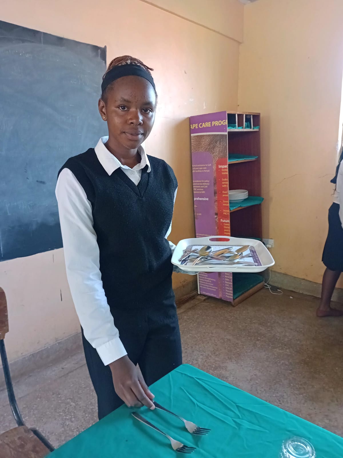 Hospitality student setting table service