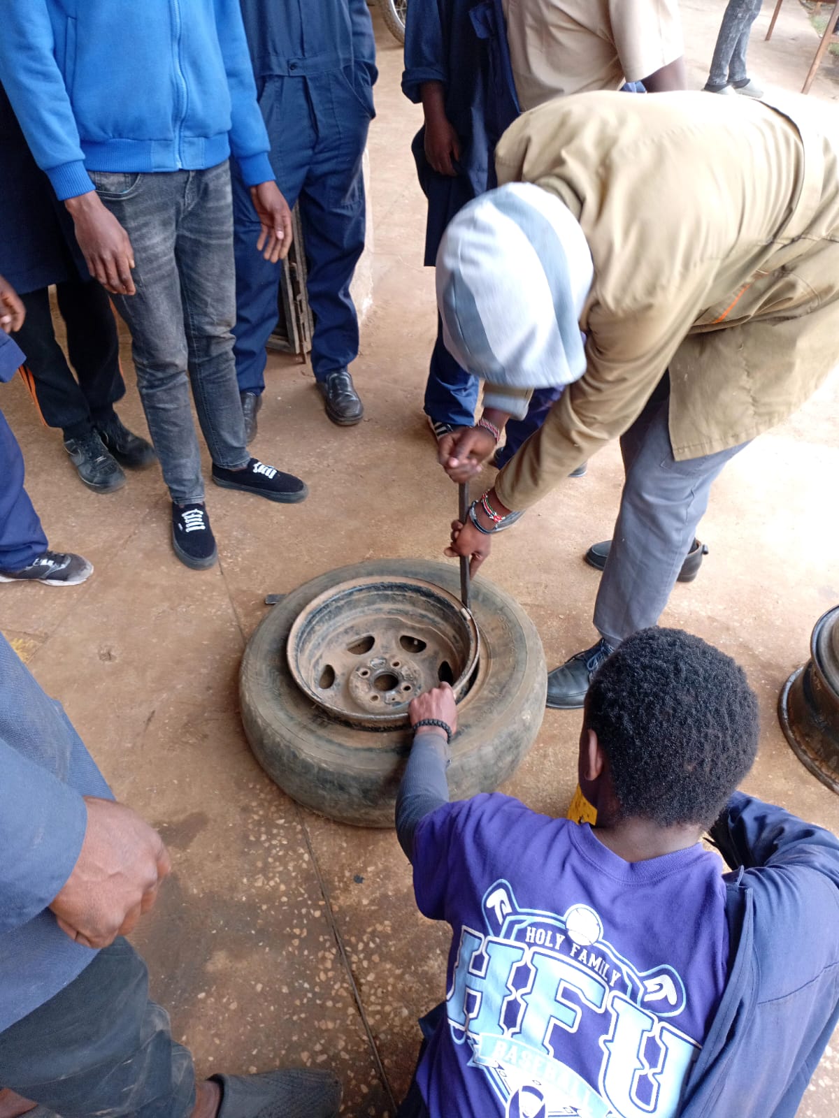 Motor vehicle mechanics students learning