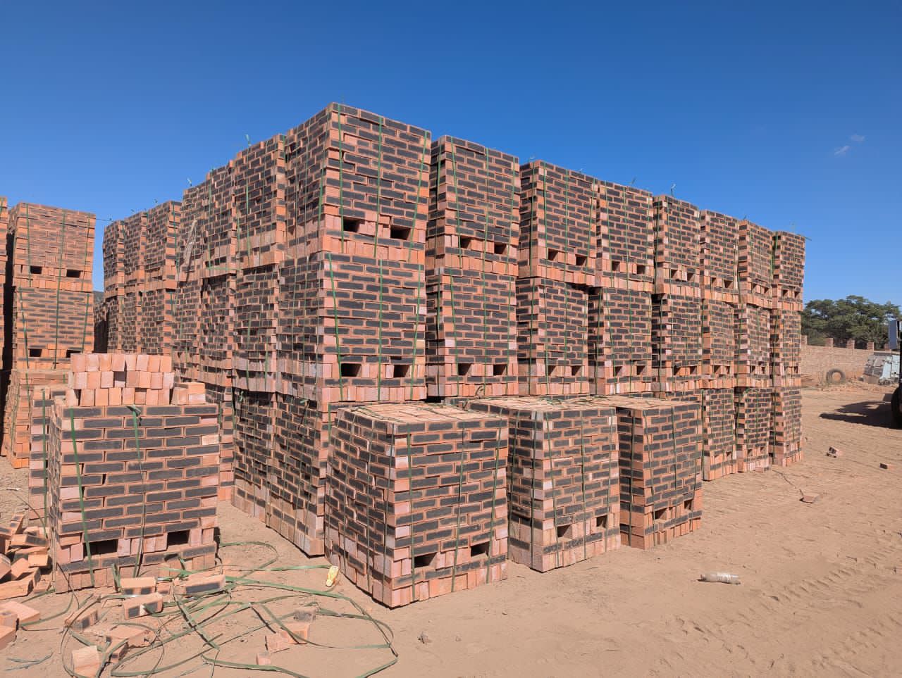 Large brick yard with stacked pallets