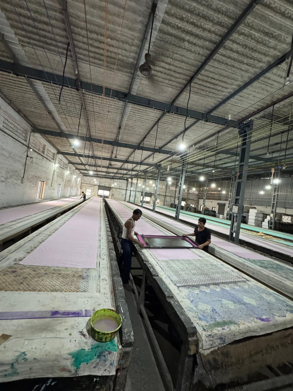 A-1 Prints screen printing floor — workers operating long printing tables in Goregaon East facility
