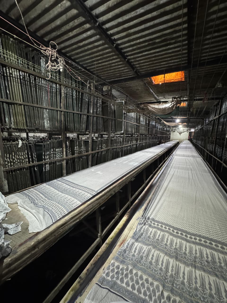 Intricate saree pattern on long dark printing table in A-1 Prints facility