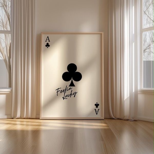 Ace of Clubs playing card on a cream background with Feelin Lucky written in handwritten script, leaning in a bright minimal room