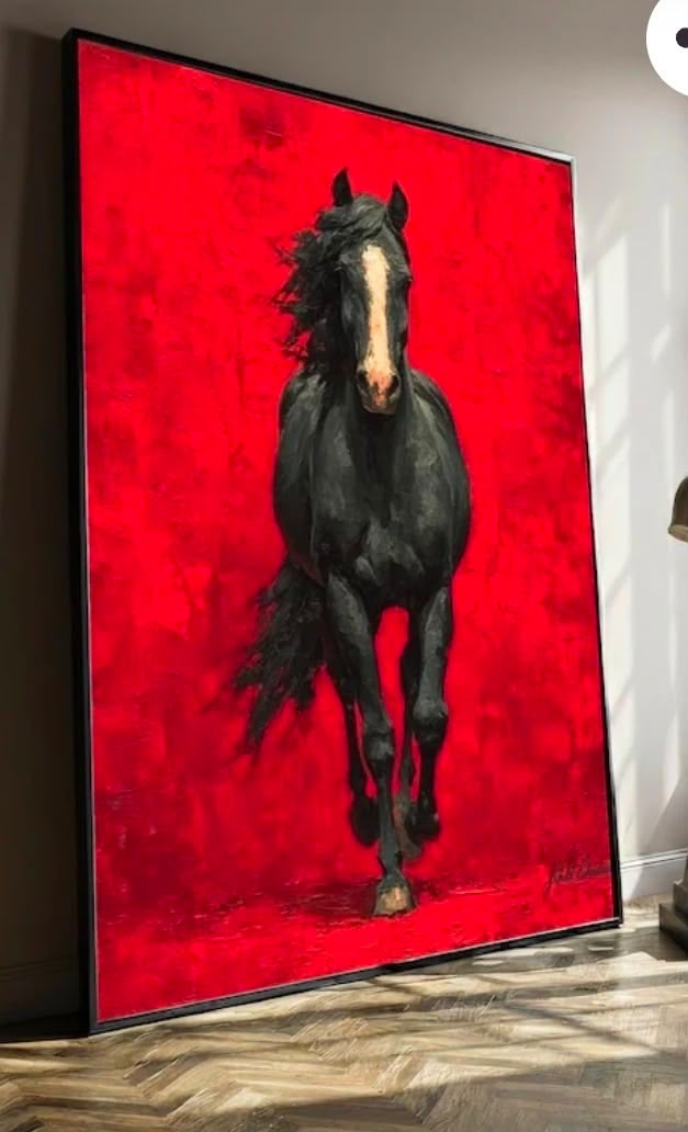 Black horse charging directly toward the viewer against a blazing crimson red heavily textured background