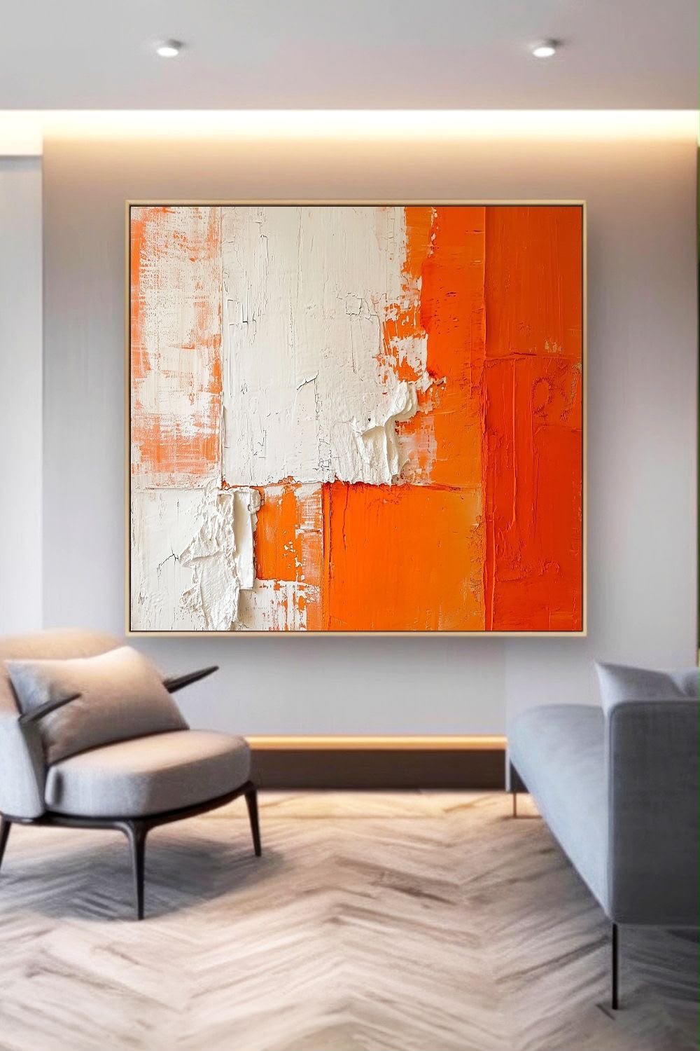 Bold orange and white textured impasto color block abstract hanging above a modern living room seating area