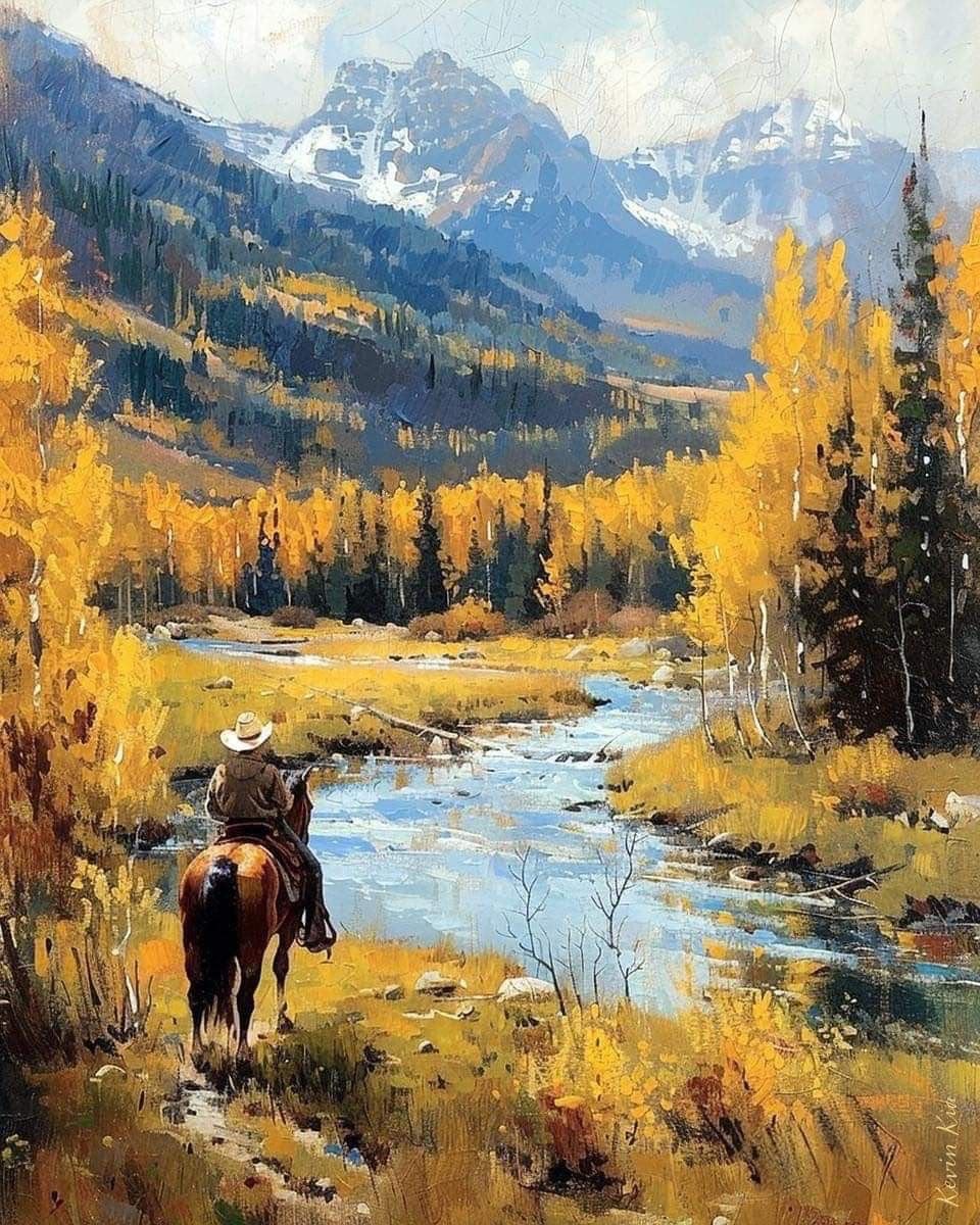 Cowboy riding a horse through a golden autumn aspen valley with a river and snow-capped peaks behind