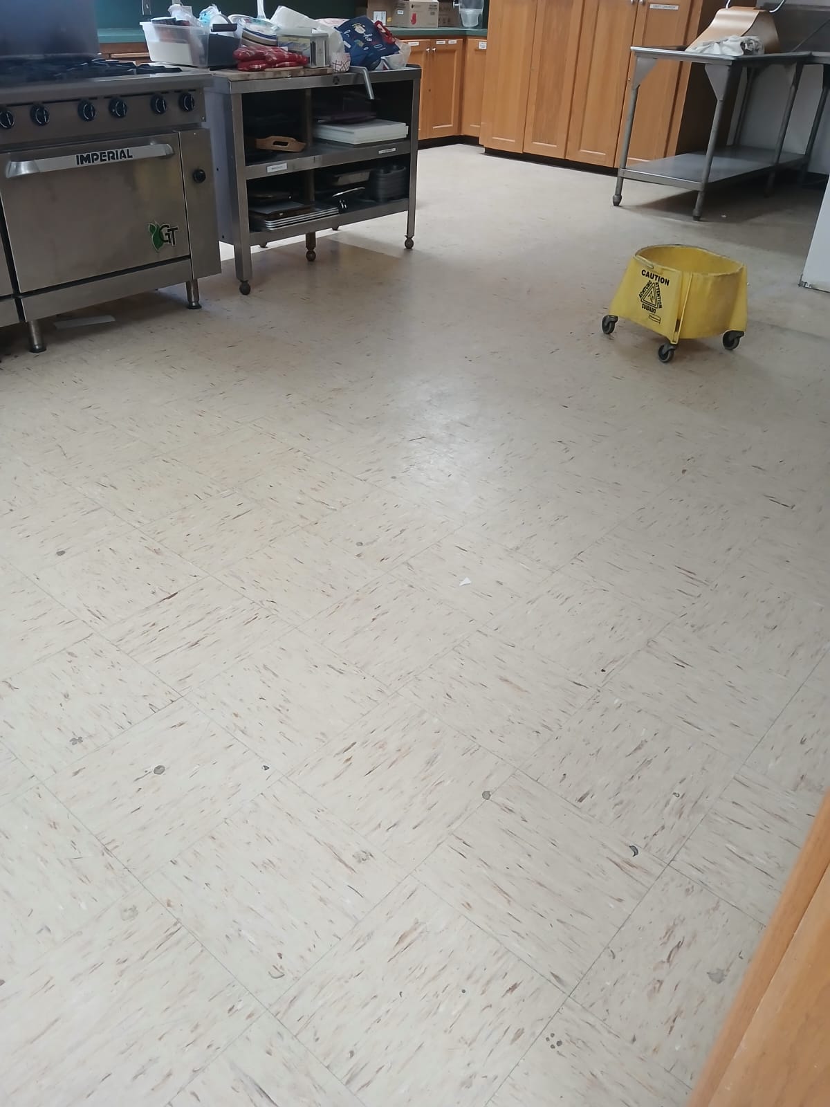 Commercial kitchen VCT floor before cleaning