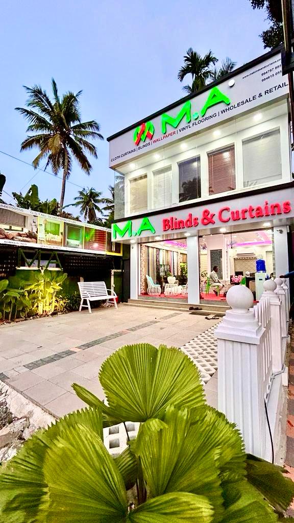 Two-storey M.A Blinds & Curtains showroom building with neon signage by M.A Blinds & Curtains