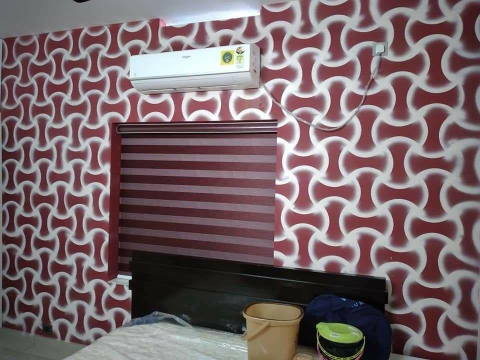 Maroon zebra blind paired with patterned red and white wallpaper in a bedroom by M.A Blinds & Curtains