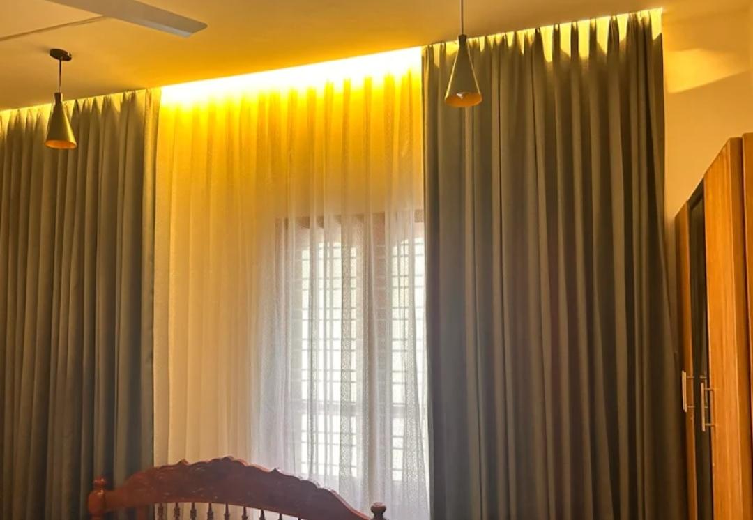 Master bedroom with luxurious pale gold and beige curtains by M.A Blinds & Curtains