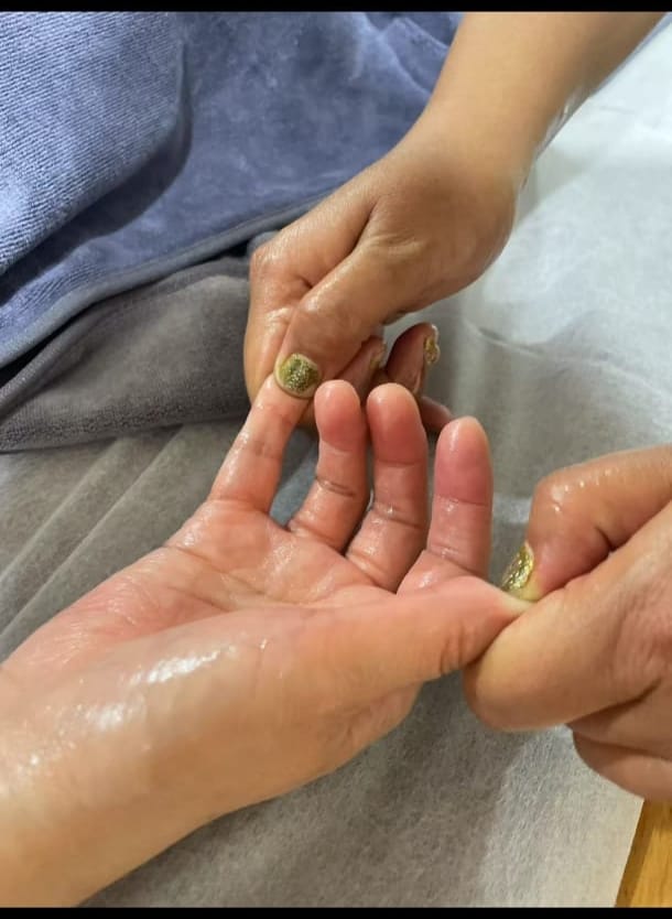 Therapeutic palm and finger massage