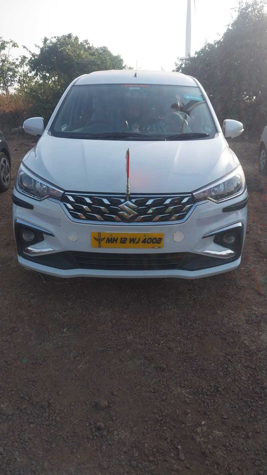 White Suzuki sedan front view