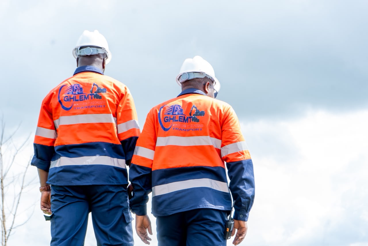 Two GHLEM transport team members in high-visibility workwear