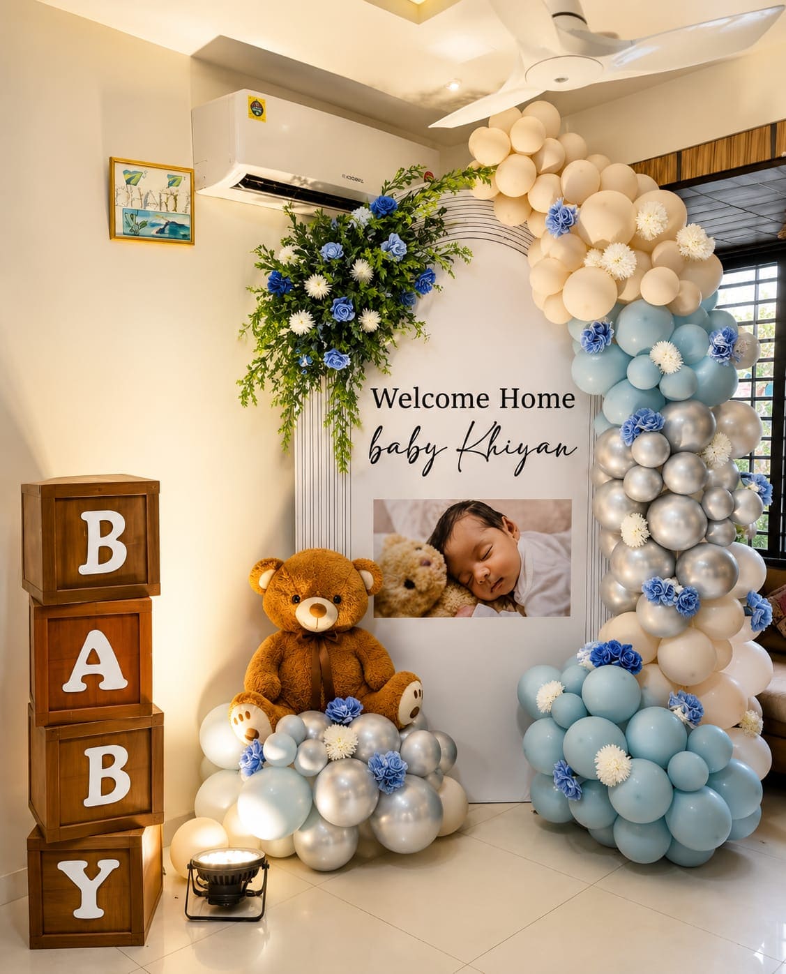 White and gold balloon arch with a boy or girl gender reveal display