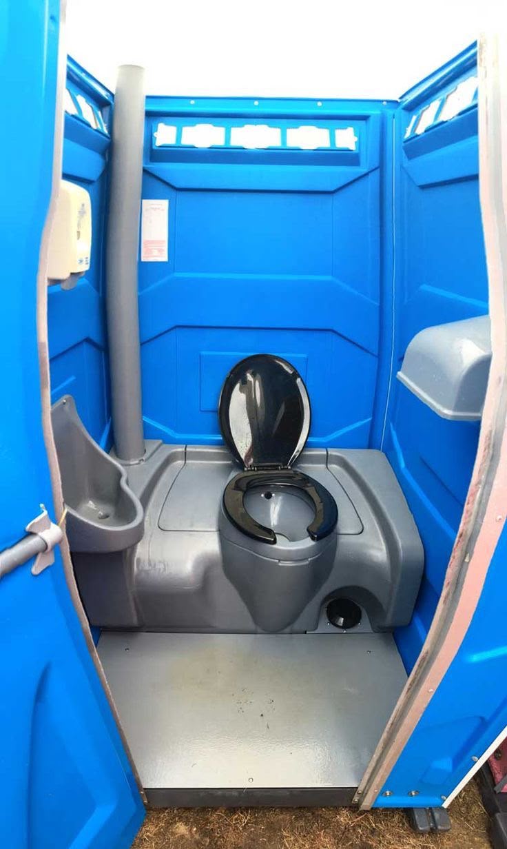 Clean interior of a blue portable restroom