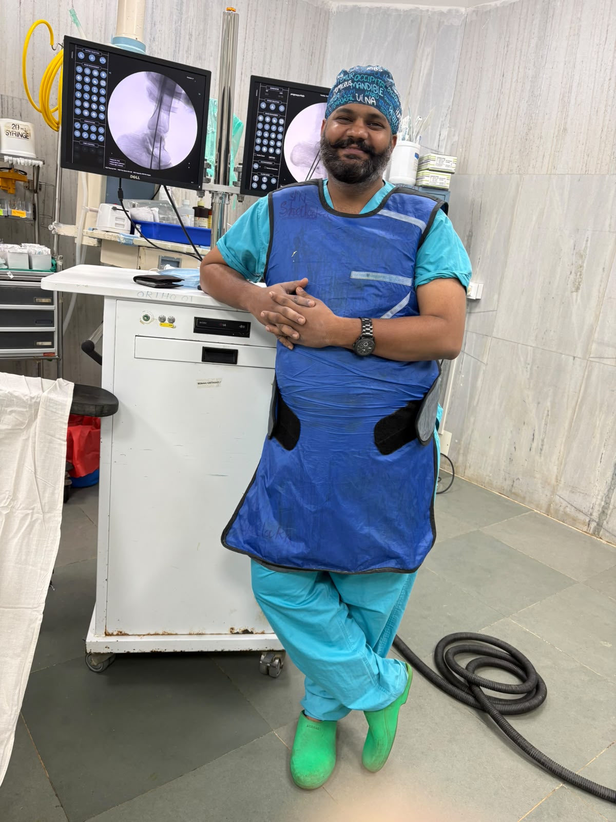 Dr. Sunil in surgical protective attire in the operating theatre