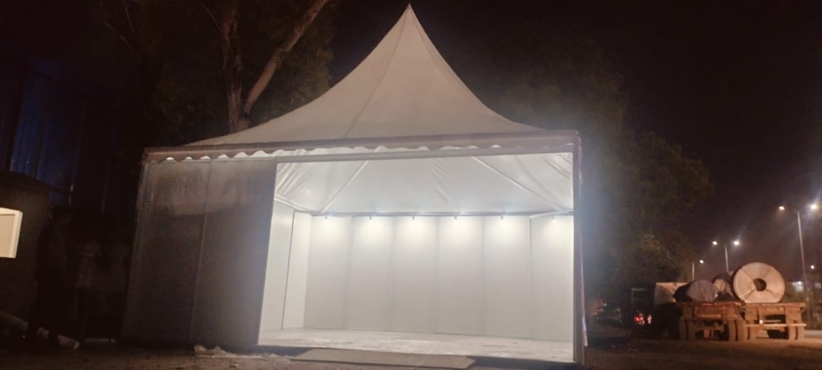 Illuminated outdoor exhibition tent at night