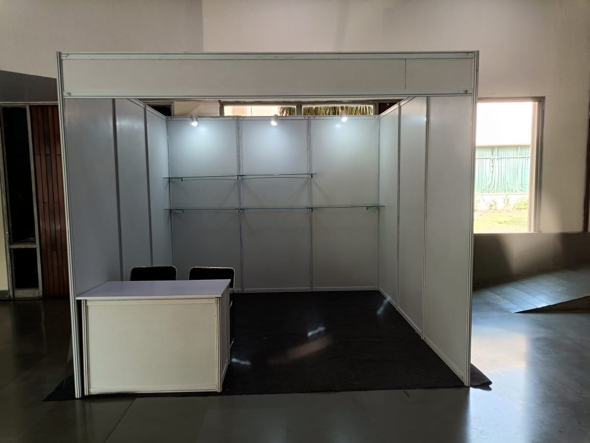 Completed indoor modular exhibition booth with reception counter
