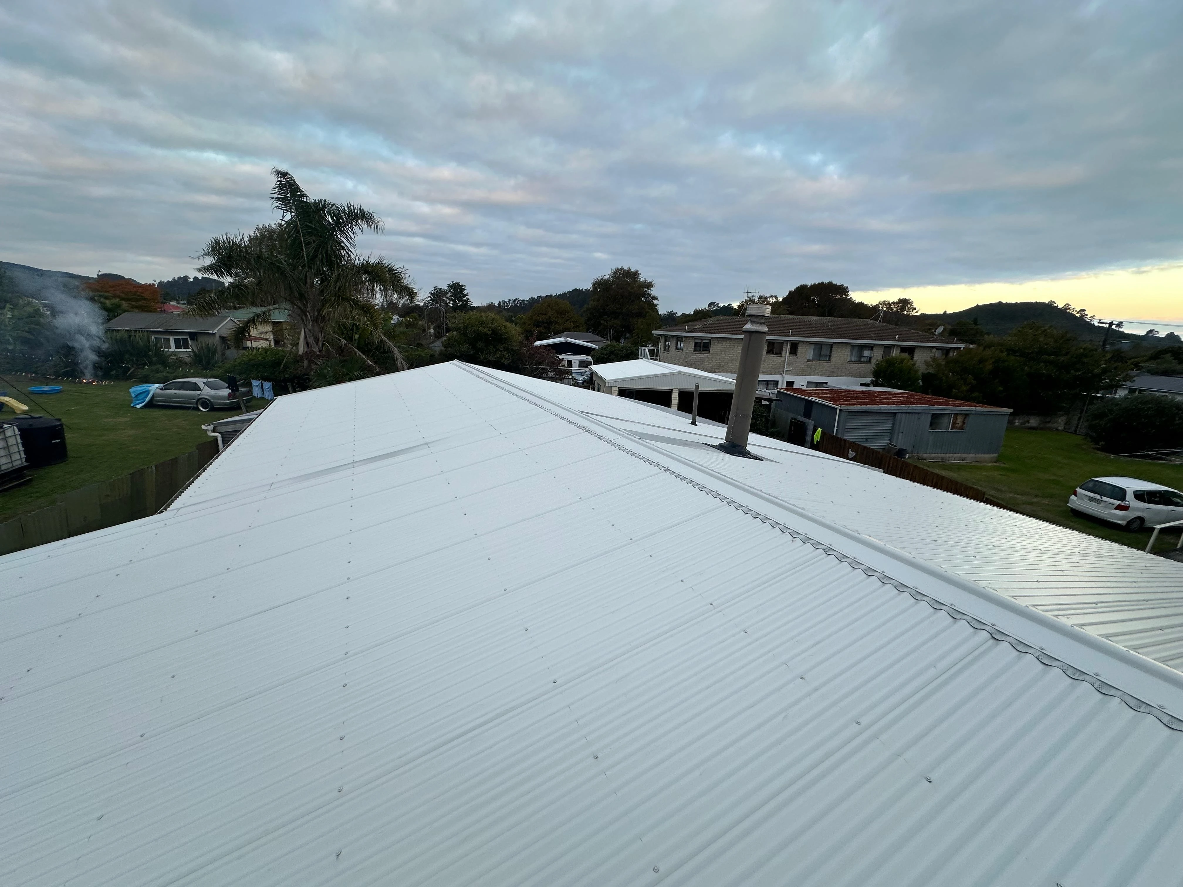 Fresh white metal roof overlooking a Papakura neighbourhood