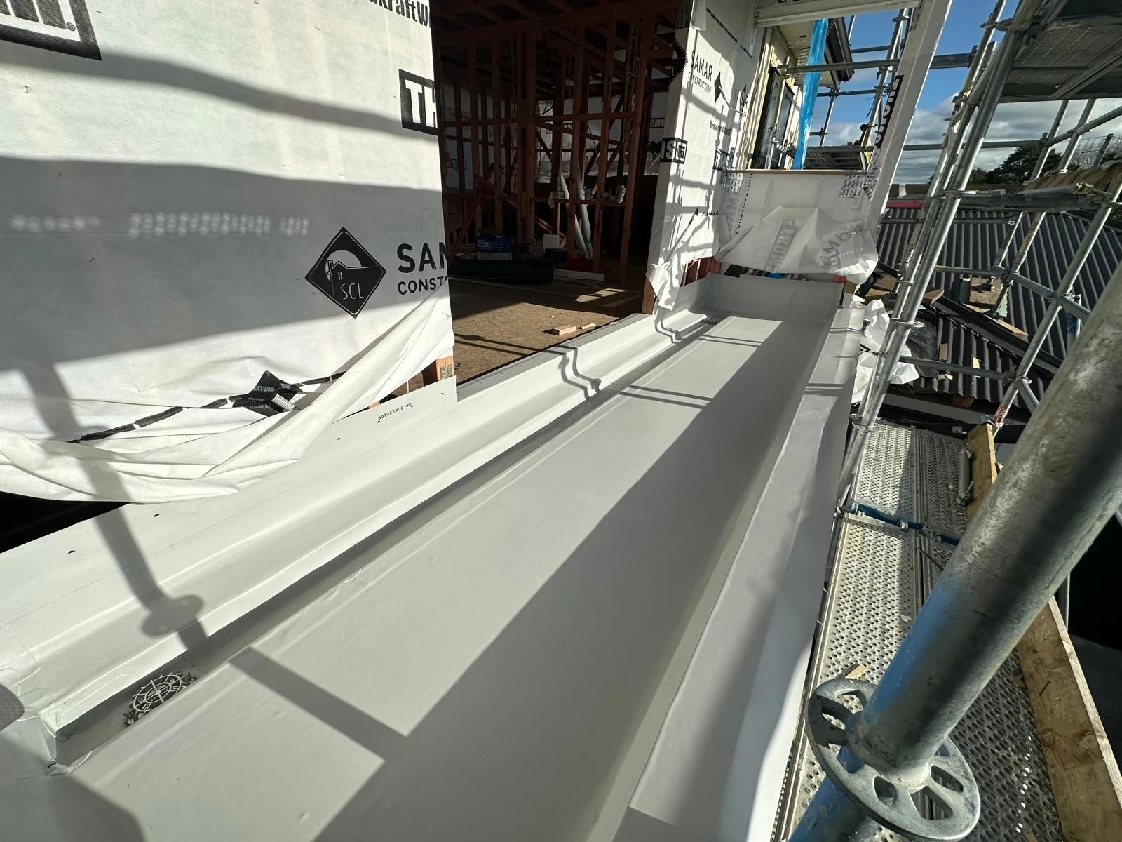 Membrane roof and flashing detail under construction