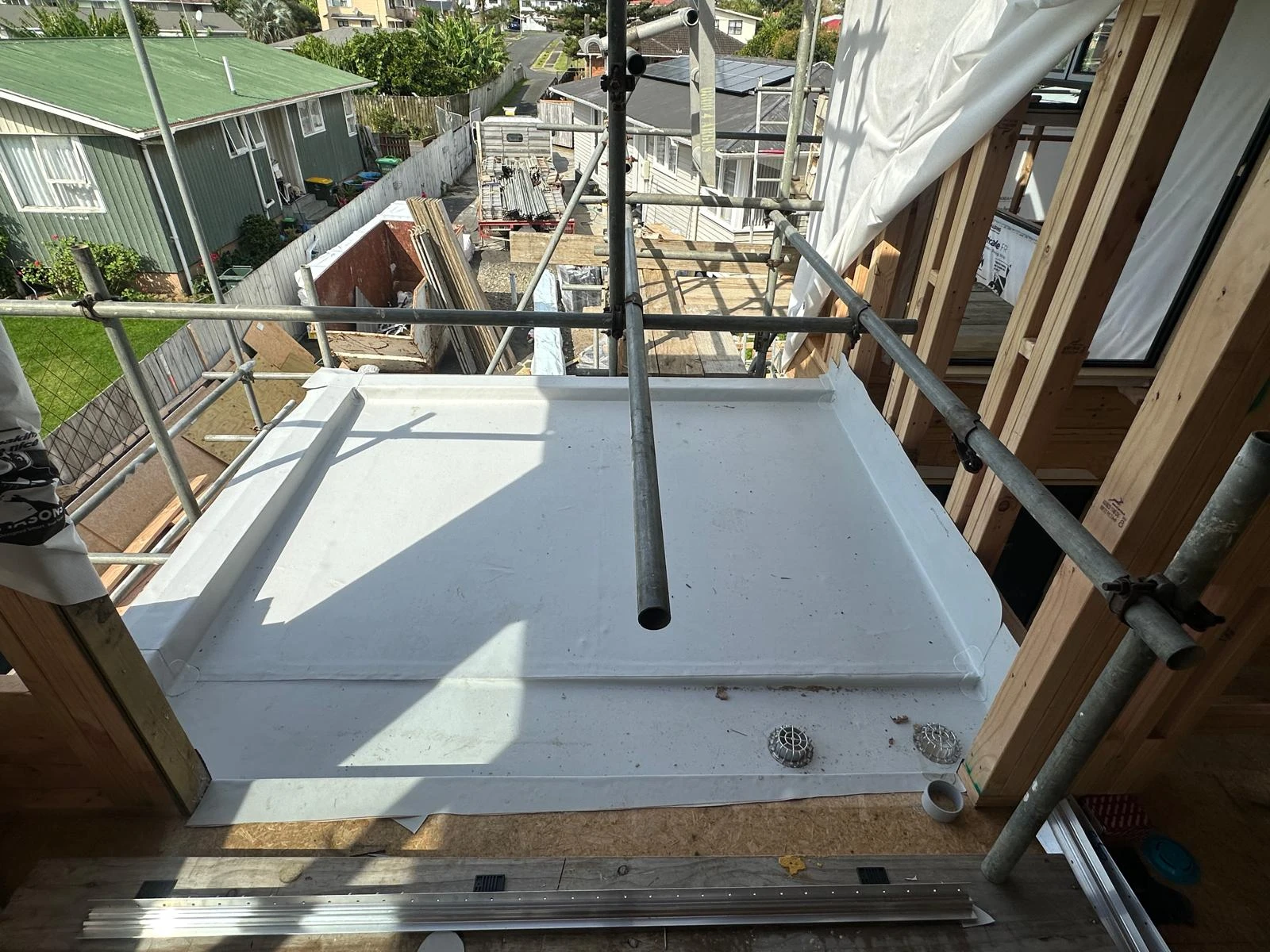 White membrane roof installed around a dormer