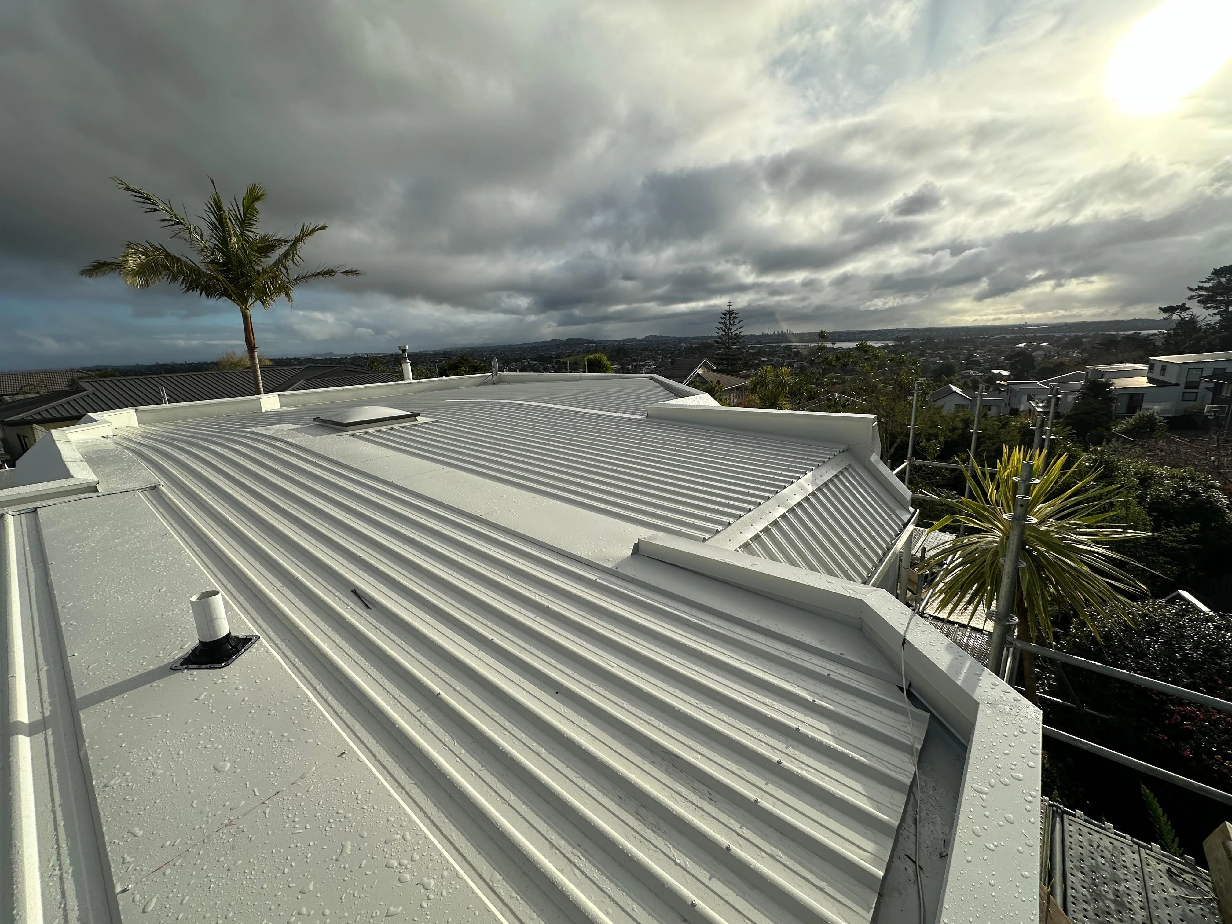 Finished white metal roof with Auckland views