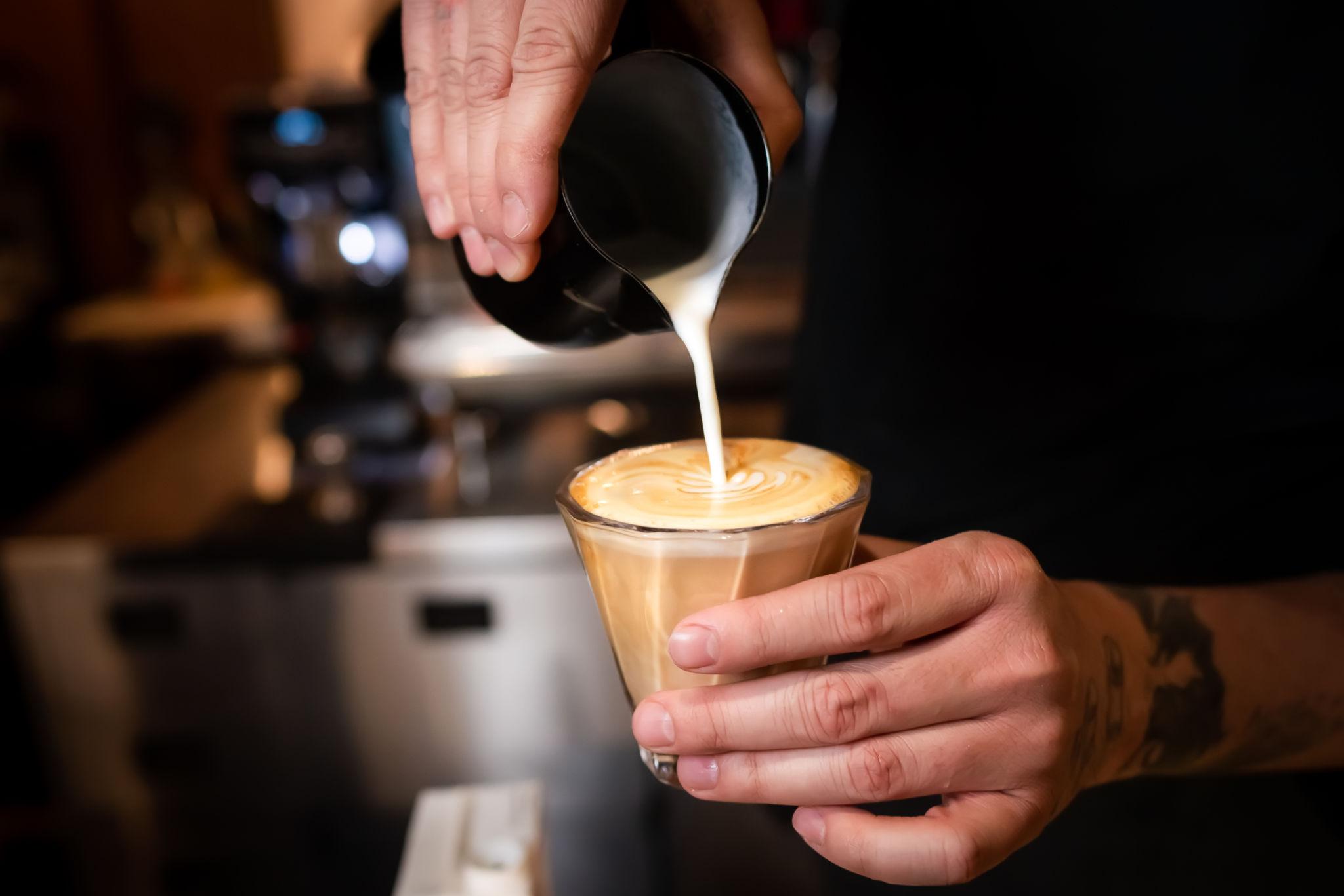 Barista pouring latte art