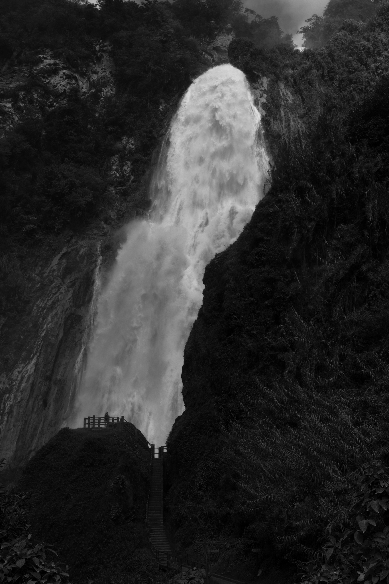 Dramatic waterfall with viewing platform and stairs leading up