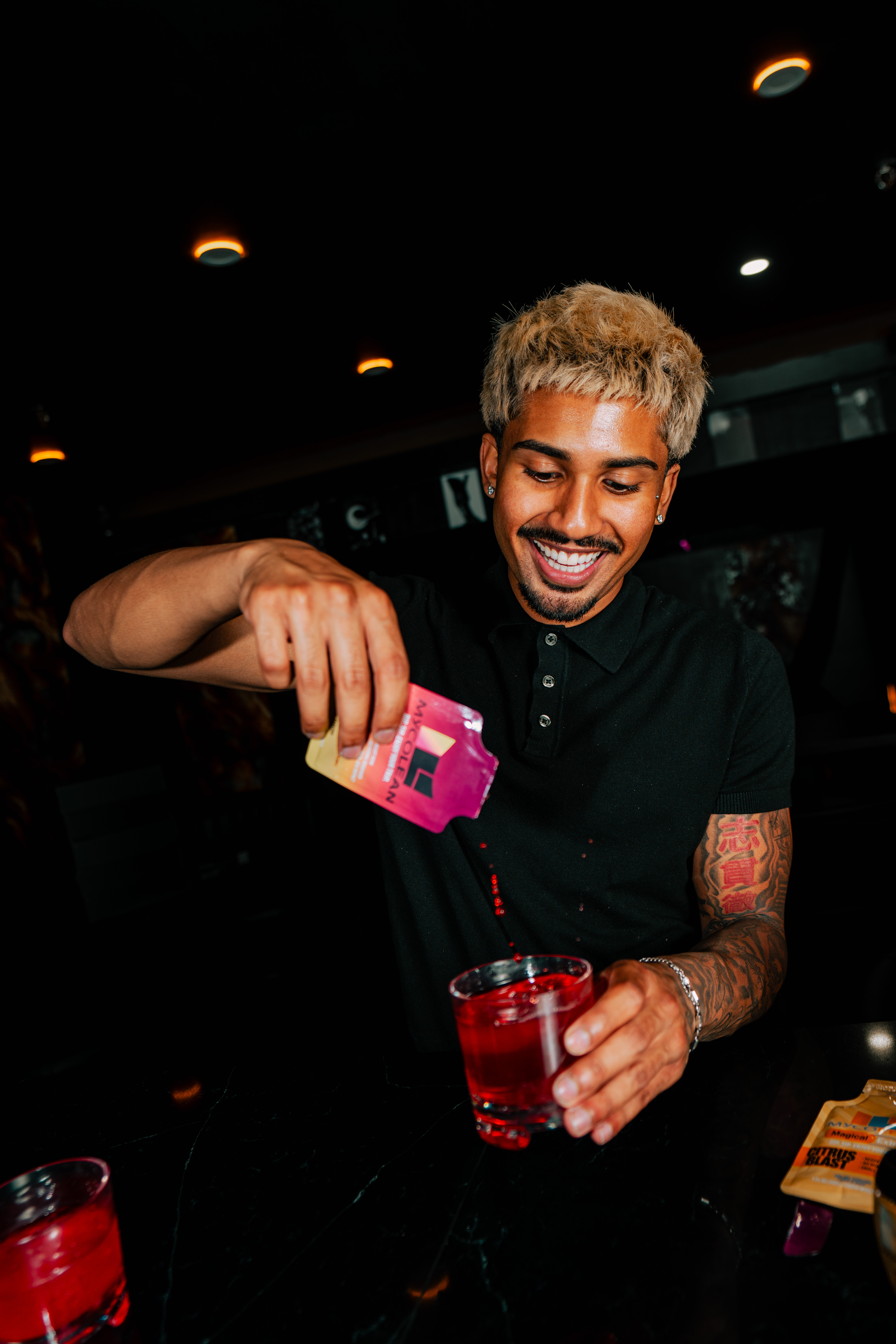 Bartender mixing a branded drink