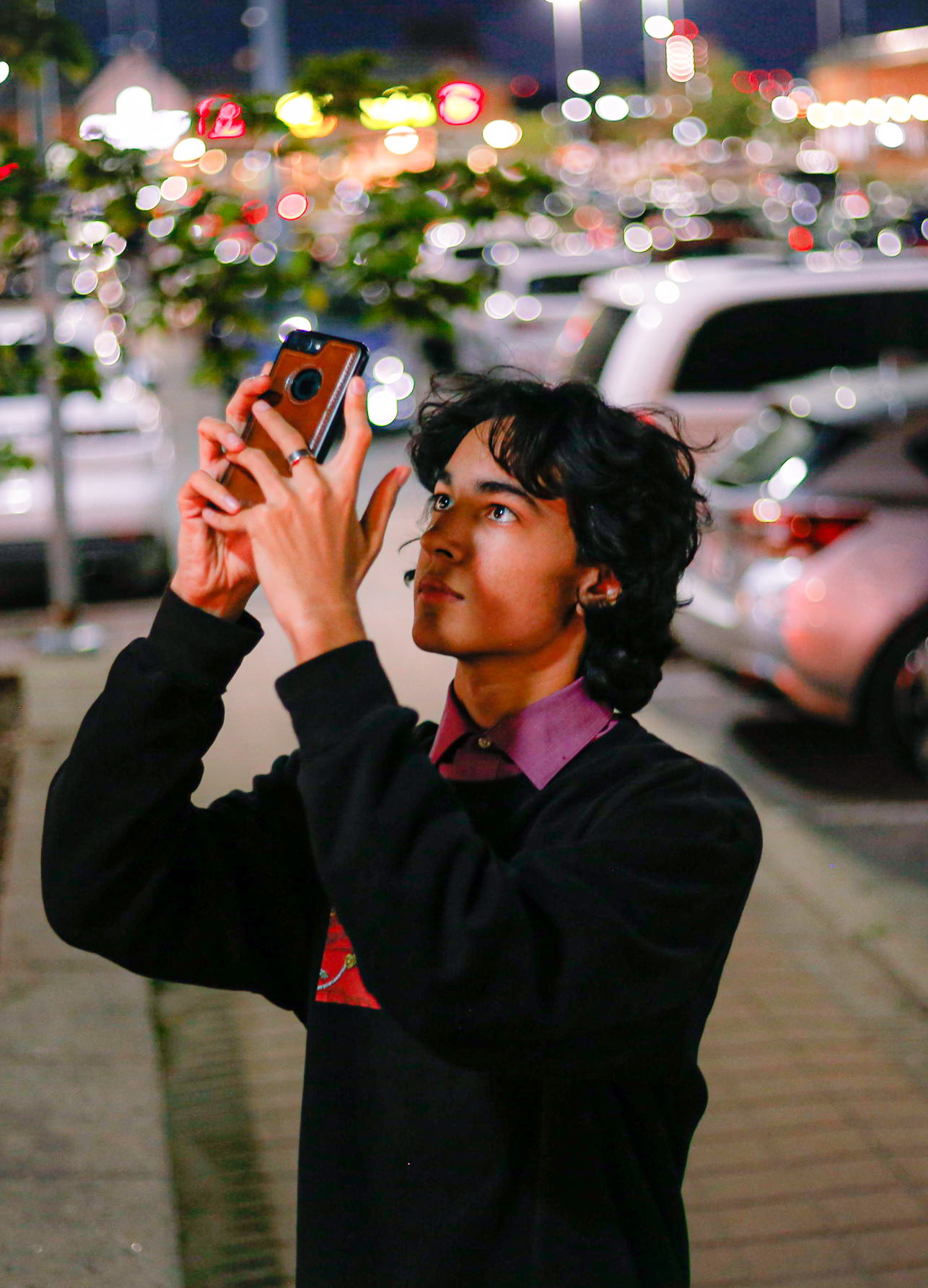 Person taking photo at night