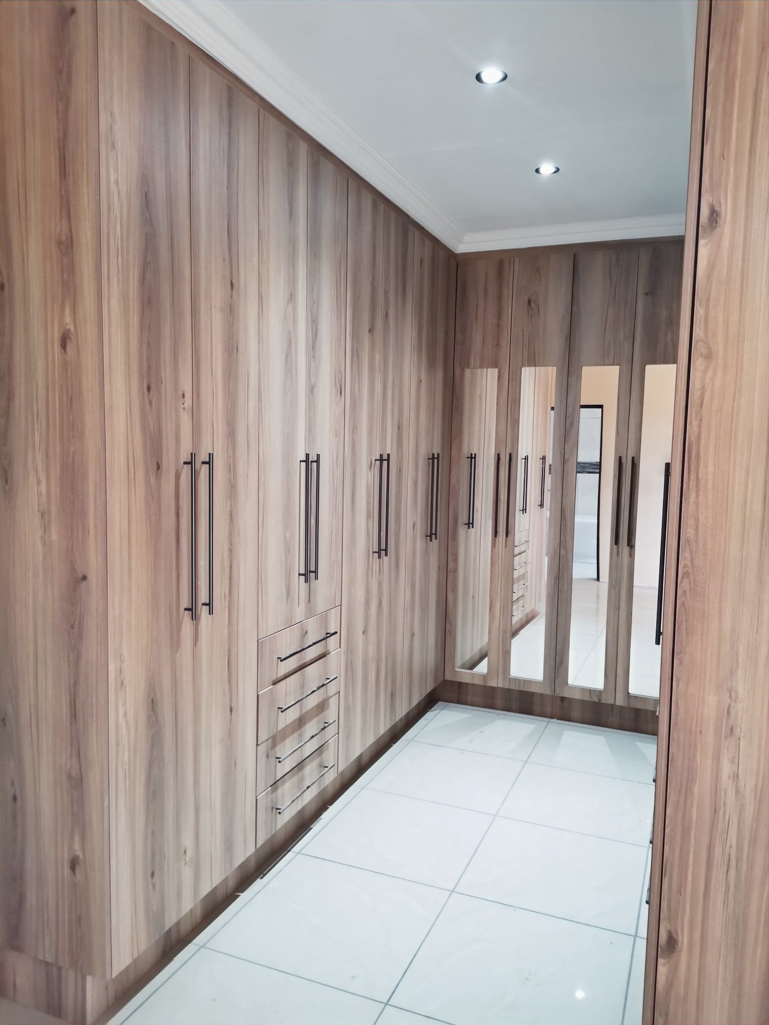 Wood Grain Walk-In with Mirror Panels