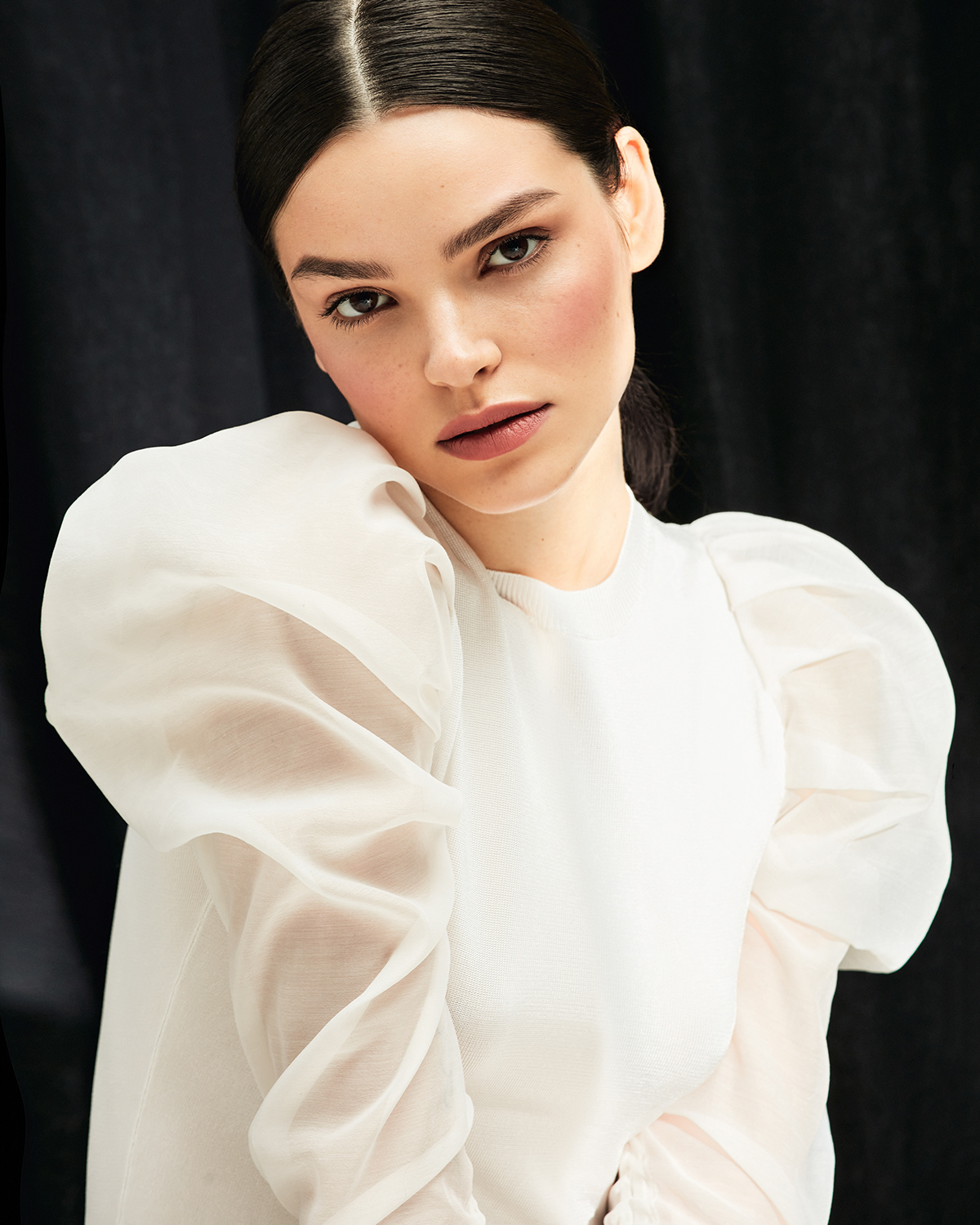 Love Republic — white organza puff-sleeve top, dark curtain backdrop