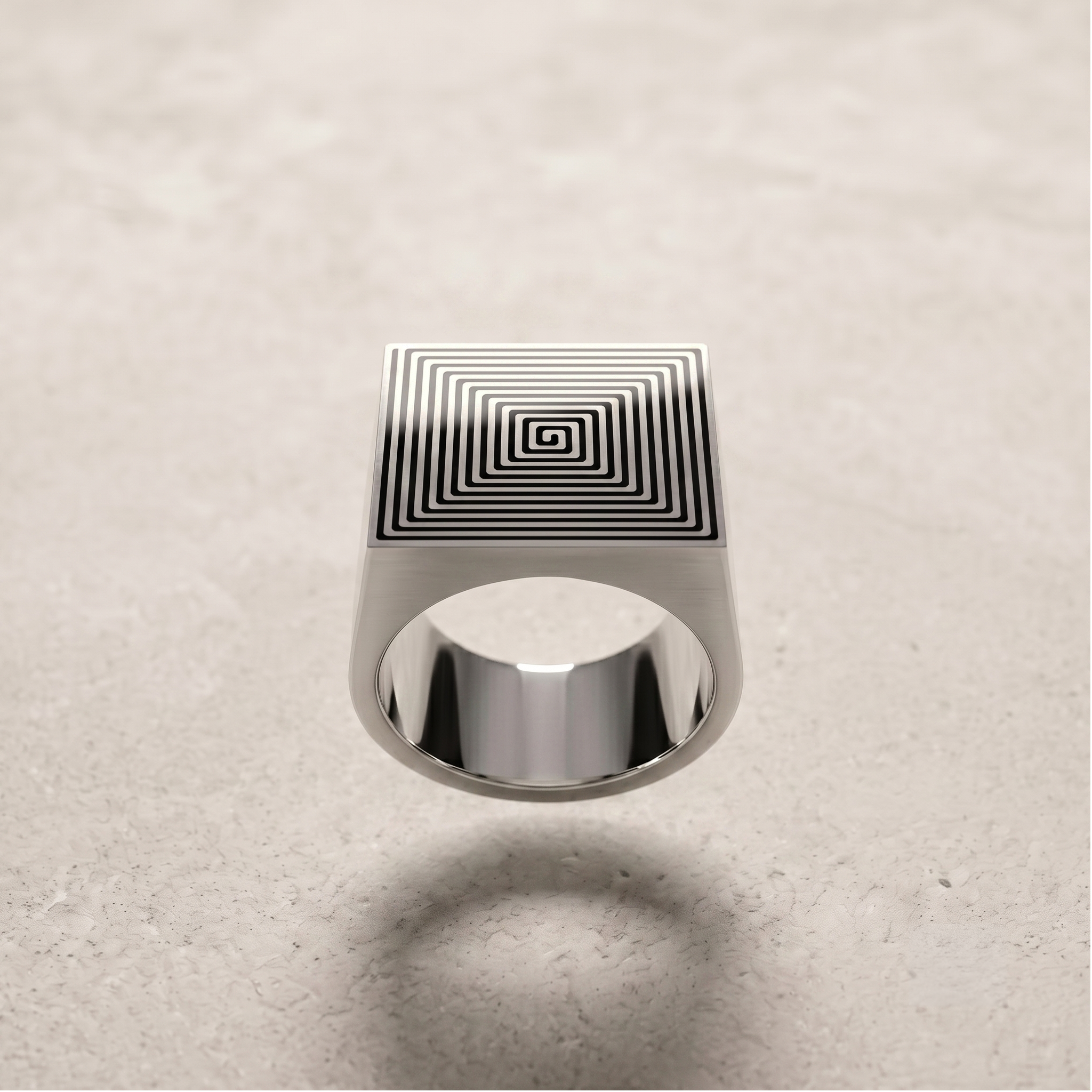 Signet 01 sterling-silver ring on a pale stone surface